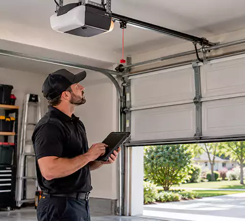Technician diagnosing a garage door that will not open or close in Indianapolis